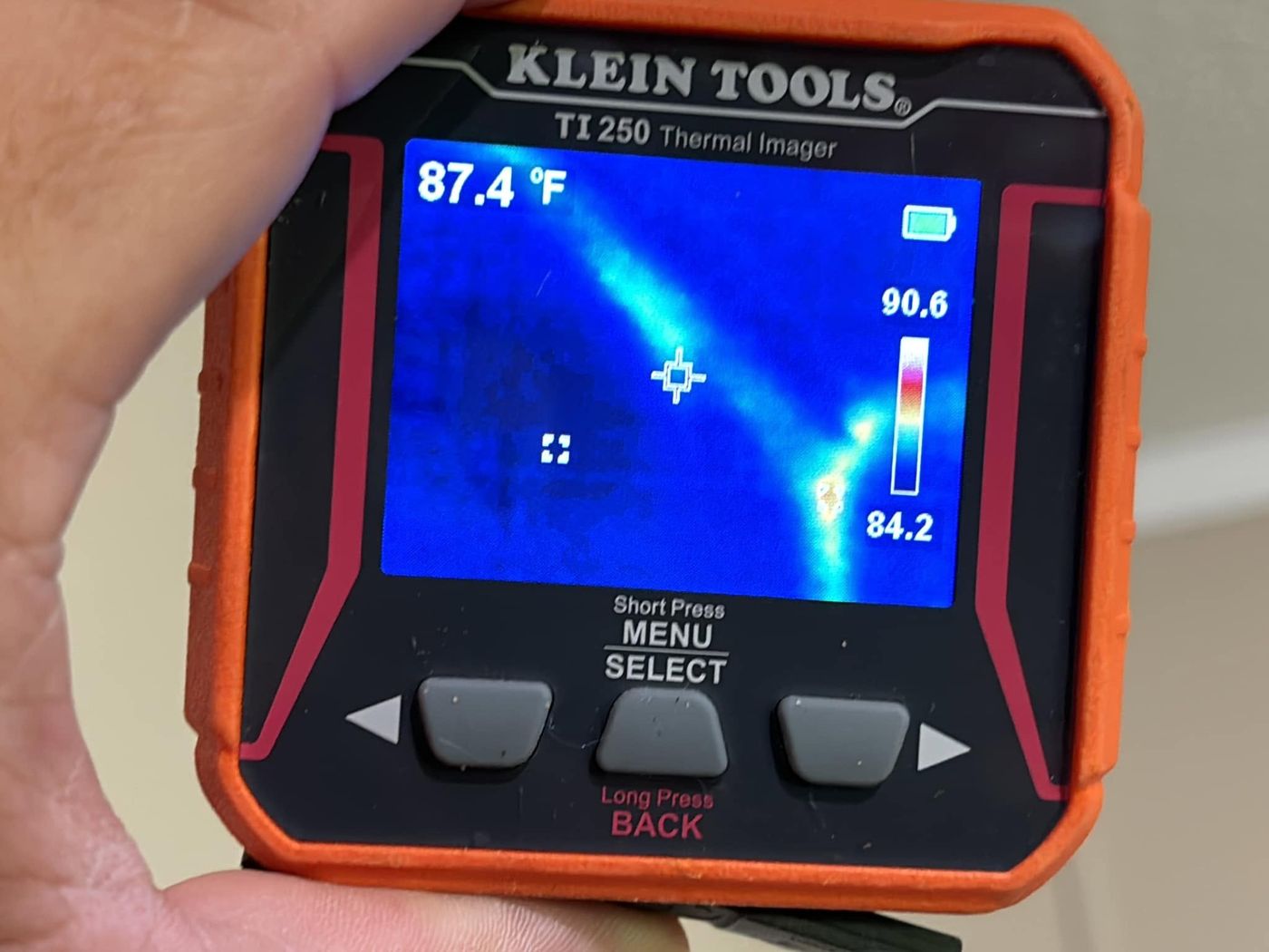 Thermal imager showing a cool moisture streak during a real inspection